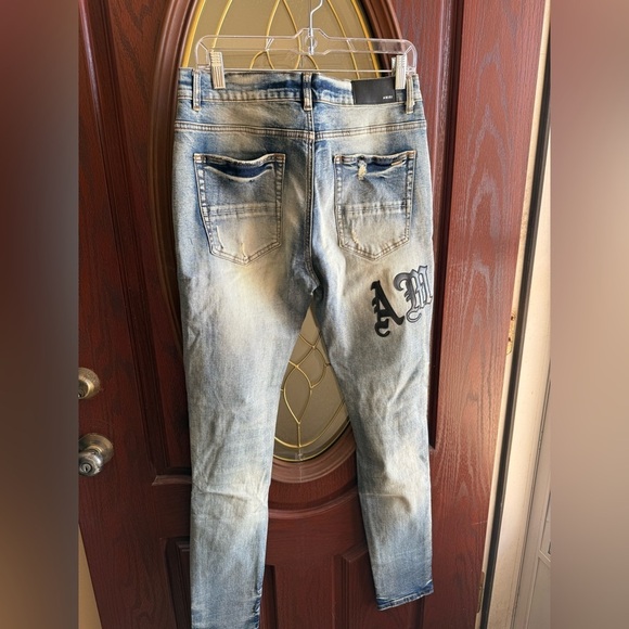 AMIRI SKINNY DESTROYED EMBROIDERED LETTERS FRAYED BUTTON FLY LIGHT WASH 32 - Picture 2 of 15